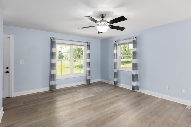 6704 Blacks Rd SW, Pataskala, OH 43062 - unfurnished room with light wood-type flooring, healthy amount of natural light, and a ceiling fan