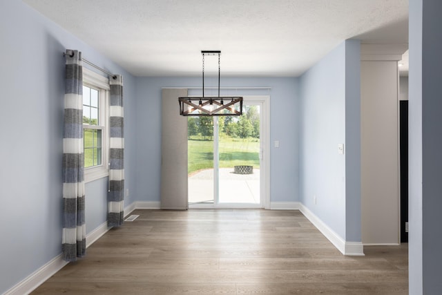 6704 Blacks Rd SW, Pataskala, OH 43062 - unfurnished dining area with wood finished floors and a chandelier