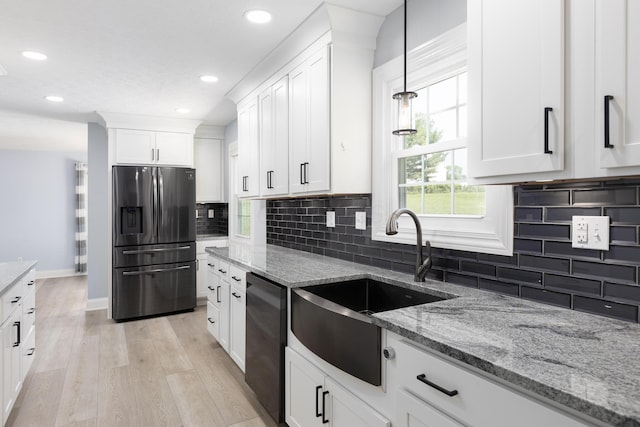 6704 Blacks Rd SW, Pataskala, OH 43062 - kitchen with stainless steel refrigerator with ice dispenser, dishwashing machine, light wood finished floors, white cabinets, and tasteful backsplash