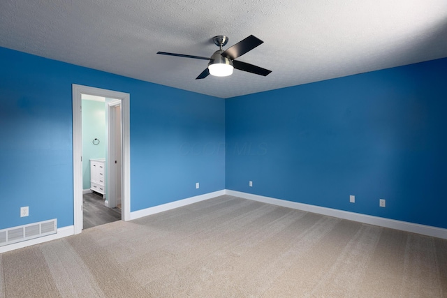 6704 Blacks Rd SW, Pataskala, OH 43062 - empty room with carpet flooring, a ceiling fan, and a textured ceiling