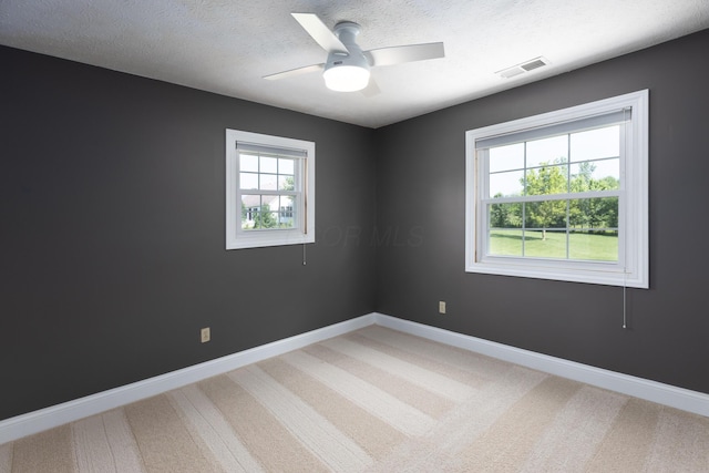 6704 Blacks Rd SW, Pataskala, OH 43062 - empty room with a textured ceiling, light carpet, and a ceiling fan