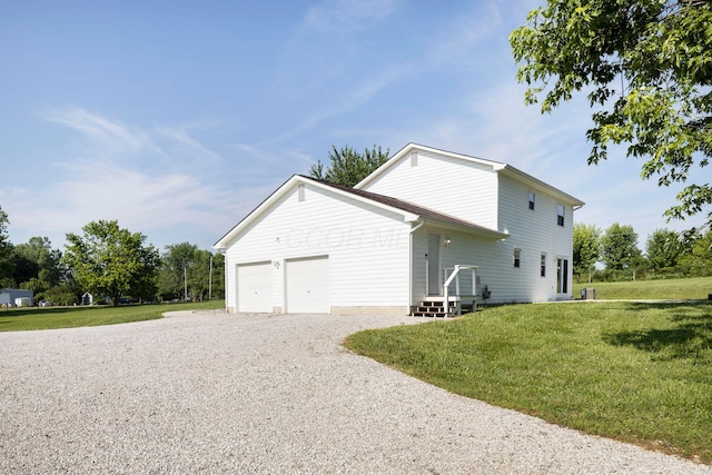 6704 Blacks Rd SW, Pataskala, OH 43062 - view of side of property with gravel driveway, a yard, and an attached garage
