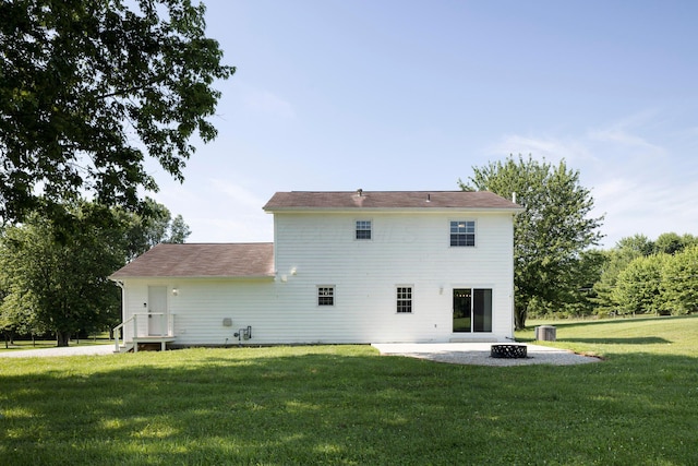 6704 Blacks Rd SW, Pataskala, OH 43062 - rear view of property featuring a lawn, an outdoor fire pit, and a patio