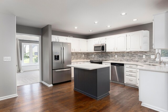 833 Moon Glow Ct, Columbus, OH 43230 - kitchen featuring stainless steel appliances, healthy amount of natural light, a kitchen island, white cabinetry, and recessed lighting