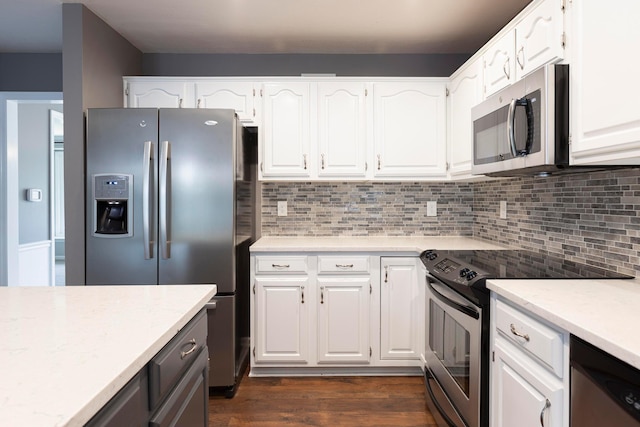 833 Moon Glow Ct, Columbus, OH 43230 - kitchen with appliances with stainless steel finishes, backsplash, white cabinets, and dark wood finished floors