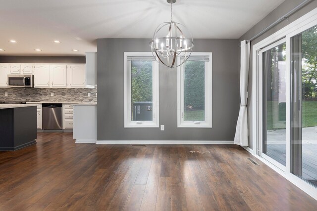833 Moon Glow Ct, Columbus, OH 43230 - unfurnished dining area with a chandelier, healthy amount of natural light, dark wood-type flooring, and recessed lighting
