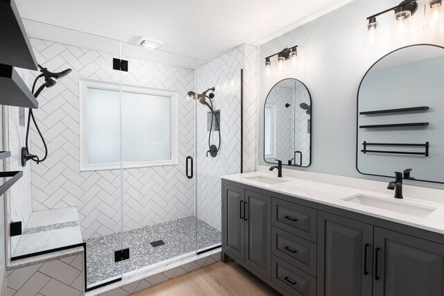833 Moon Glow Ct, Columbus, OH 43230 - full bathroom featuring double vanity, a shower stall, and wood finished floors