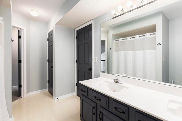 833 Moon Glow Ct, Columbus, OH 43230 - full bathroom featuring double vanity and baseboards