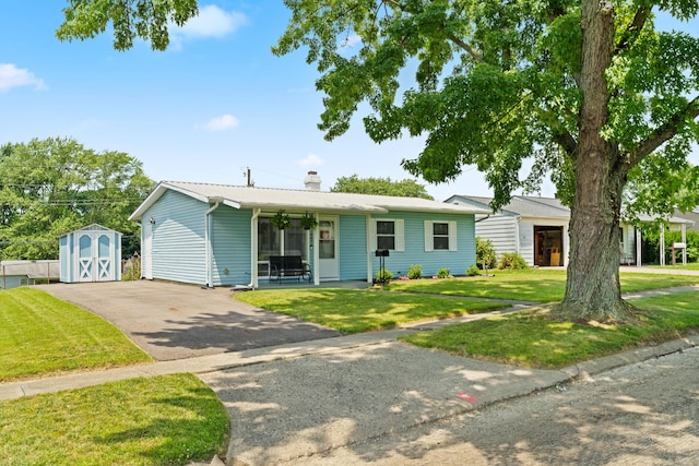 507 Shoshone Dr, Lancaster, OH 43130 - single story home with a storage shed, a front lawn, a chimney, and driveway
