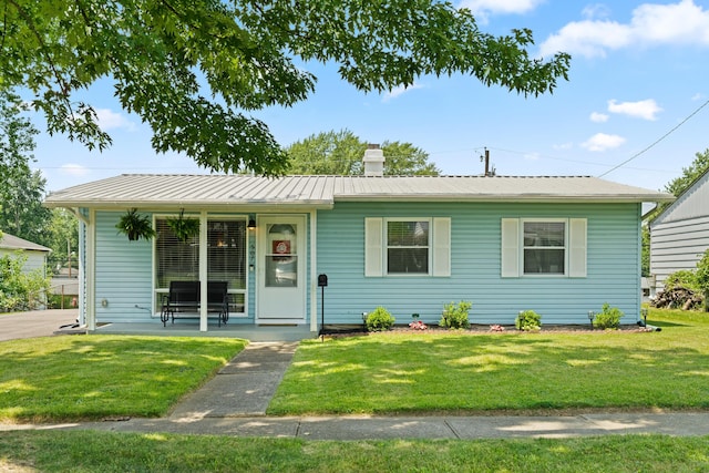 507 Shoshone Dr, Lancaster, OH 43130 - ranch-style house with a front yard, a chimney, a metal roof, and covered porch