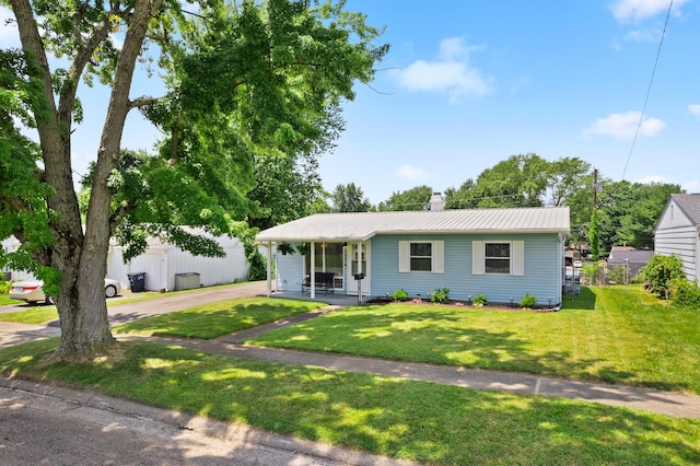 507 Shoshone Dr, Lancaster, OH 43130 - view of front of house with a front lawn, covered porch, a chimney, a metal roof, and driveway