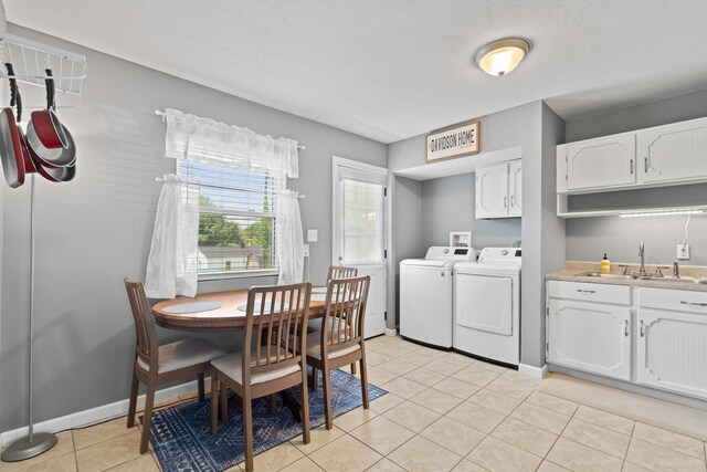 507 Shoshone Dr, Lancaster, OH 43130 - dining area featuring washing machine and clothes dryer and light tile patterned floors