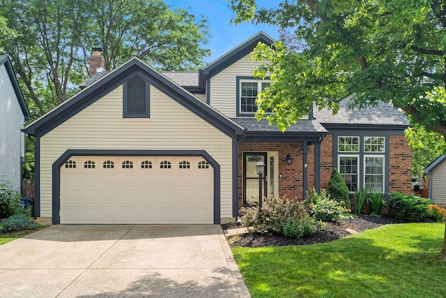 1126 Welwyn Dr, Westerville, OH 43081 - view of front of house with concrete driveway, brick siding, a front lawn, and a shingled roof