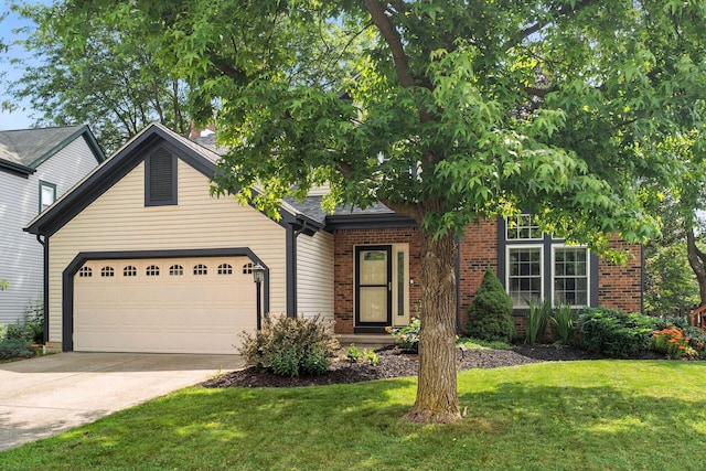 1126 Welwyn Dr, Westerville, OH 43081 - view of front of property with a garage, concrete driveway, a front yard, and brick siding