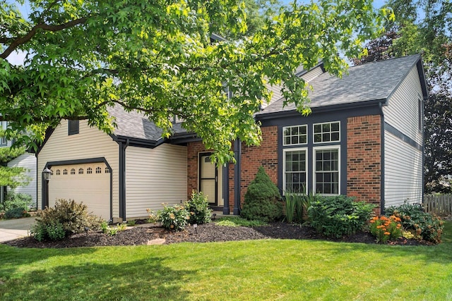 1126 Welwyn Dr, Westerville, OH 43081 - view of front facade featuring an attached garage, brick siding, and a shingled roof