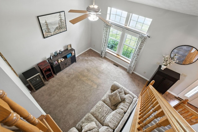 1126 Welwyn Dr, Westerville, OH 43081 - living room with healthy amount of natural light, ceiling fan, and carpet floors