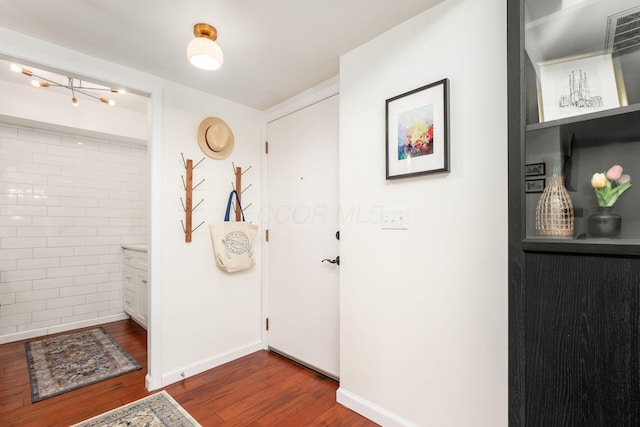 249 E Kossuth St Unit E, Columbus, OH 43206 - entrance foyer with dark wood-type flooring and baseboards