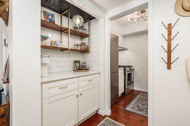 249 E Kossuth St Unit E, Columbus, OH 43206 - kitchen featuring stainless steel appliances, dark wood-style flooring, white cabinetry, under cabinet range hood, and backsplash