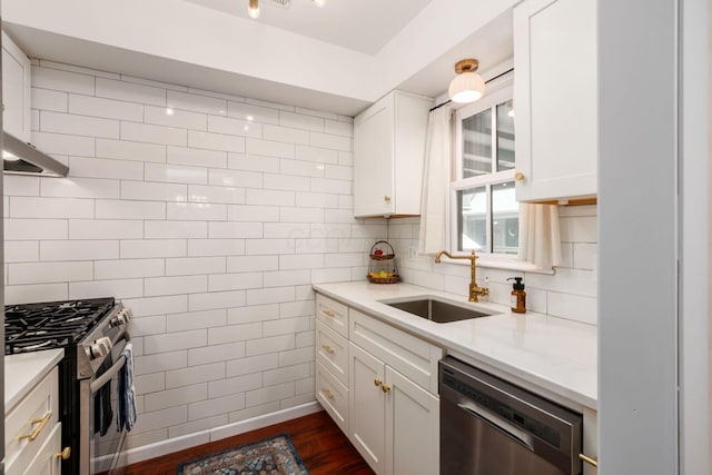 249 E Kossuth St Unit E, Columbus, OH 43206 - kitchen featuring stainless steel appliances, dark wood-style floors, white cabinets, light stone counters, and tasteful backsplash