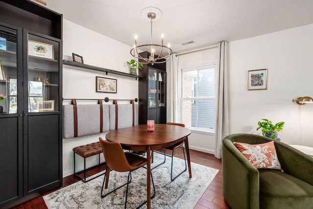 249 E Kossuth St Unit E, Columbus, OH 43206 - dining area featuring a chandelier and dark wood finished floors
