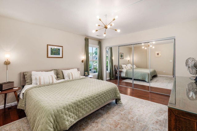 249 E Kossuth St Unit E, Columbus, OH 43206 - bedroom featuring a chandelier, wood finished floors, and a closet