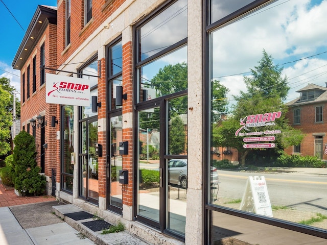 249 E Kossuth St Unit E, Columbus, OH 43206 - doorway to outside featuring a towering ceiling and healthy amount of natural light