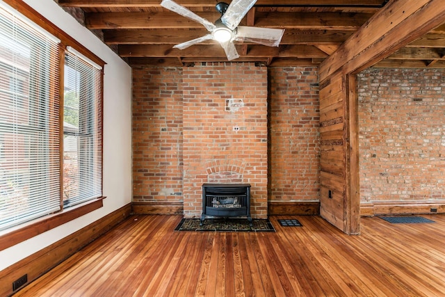 867-871 Delaware Ave, Columbus, OH 43215 - unfurnished living room featuring hardwood / wood-style flooring, a wood ceiling with exposed beams, a fireplace, and a ceiling fan