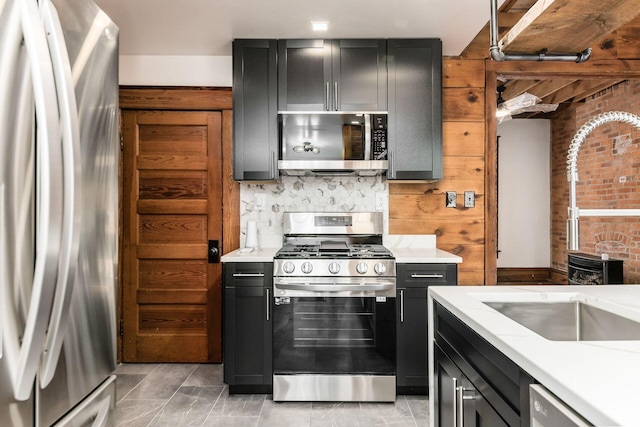 867-871 Delaware Ave, Columbus, OH 43215 - kitchen with stainless steel appliances, light countertops, and dark cabinets