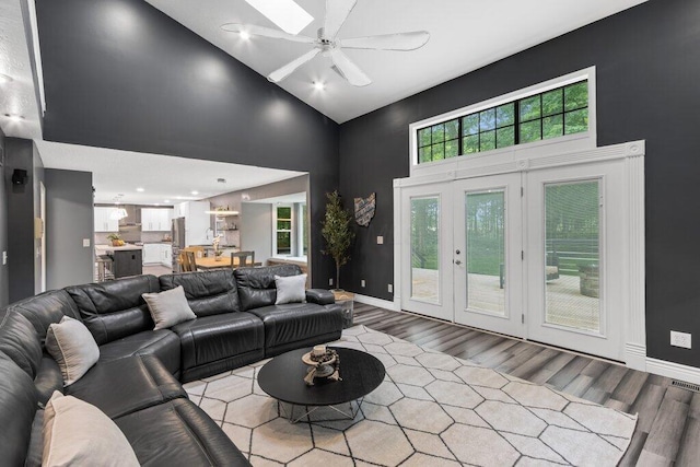 10382 Wright Rd NW, Canal Winchester, OH 43110 - living area featuring high vaulted ceiling, wood finished floors, ceiling fan, recessed lighting, and french doors