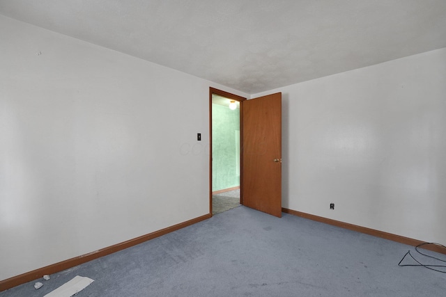 412 E Mill St, Circleville, OH 43113 - carpeted empty room featuring baseboards
