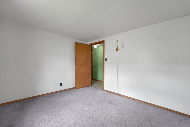 412 E Mill St, Circleville, OH 43113 - empty room with baseboards and light carpet