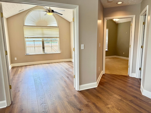 6608 Lakeview Cir, Canal Winchester, OH 43110 - corridor featuring dark wood-type flooring, a textured ceiling, and vaulted ceiling