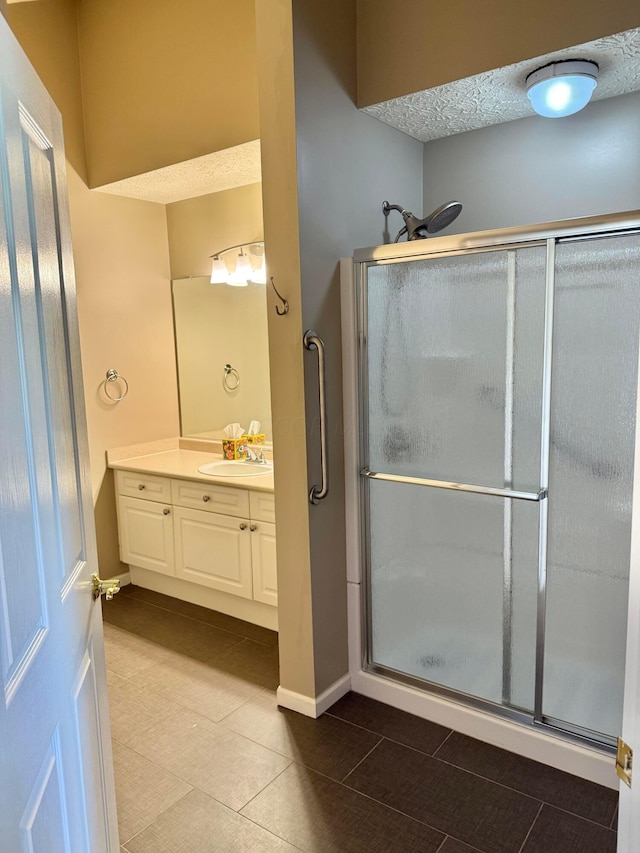 6608 Lakeview Cir, Canal Winchester, OH 43110 - full bathroom with vanity, a stall shower, tile patterned floors, and a textured ceiling