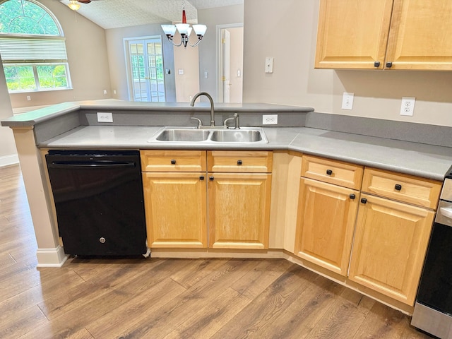 6608 Lakeview Cir, Canal Winchester, OH 43110 - kitchen with black dishwasher, a peninsula, lofted ceiling, and light wood-style floors