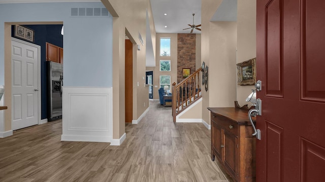 6229 Janes Way, Hilliard, OH 43026 - entryway featuring a ceiling fan, light wood finished floors, and stairway