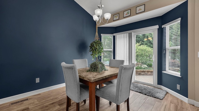 6229 Janes Way, Hilliard, OH 43026 - dining space featuring a chandelier, wood finished floors, and lofted ceiling
