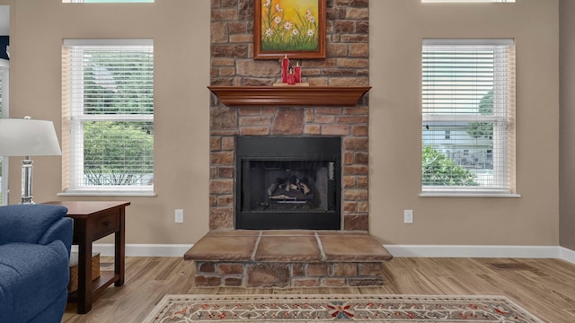 6229 Janes Way, Hilliard, OH 43026 - living room featuring wood finished floors, healthy amount of natural light, and a fireplace