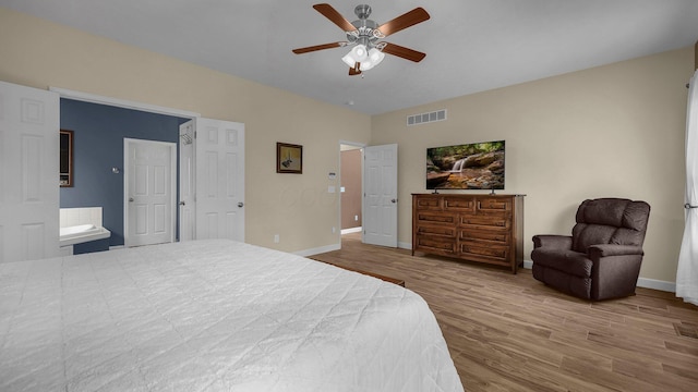 6229 Janes Way, Hilliard, OH 43026 - bedroom with wood finished floors, a ceiling fan, and ensuite bathroom
