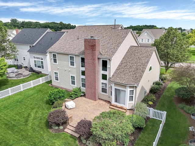 6229 Janes Way, Hilliard, OH 43026 - back of property featuring a shingled roof, a chimney, a fenced backyard, a patio, and a residential view