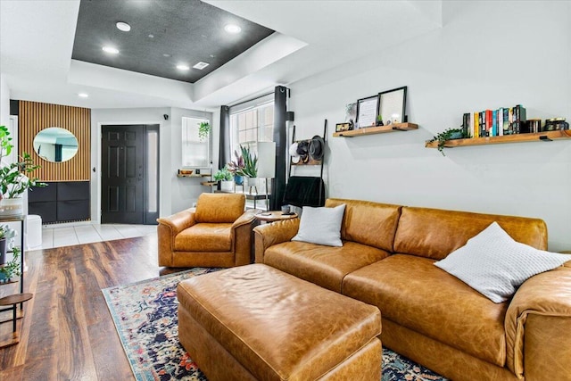 5821 Albany Grv, Westerville, OH 43081 - living room with a raised ceiling, wood finished floors, and recessed lighting