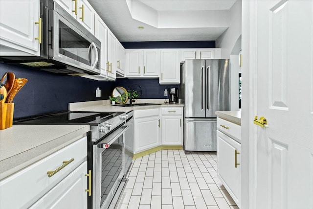 5821 Albany Grv, Westerville, OH 43081 - kitchen featuring stainless steel appliances, light countertops, and white cabinetry