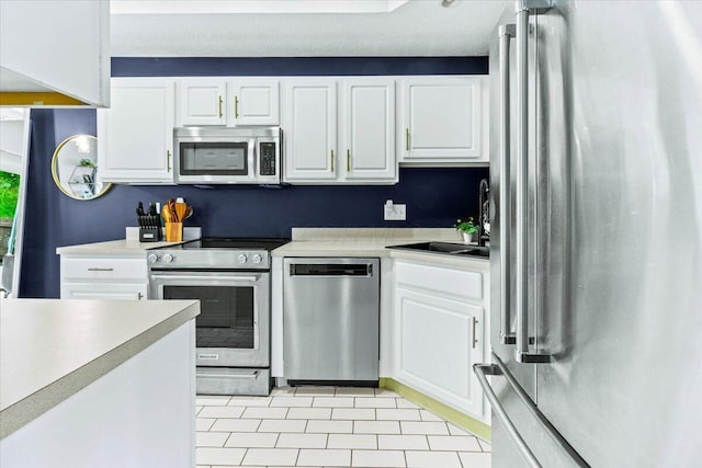 5821 Albany Grv, Westerville, OH 43081 - kitchen with stainless steel appliances, white cabinets, and light countertops
