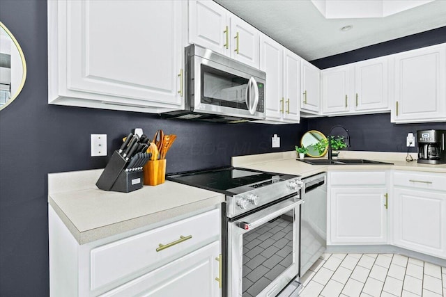 5821 Albany Grv, Westerville, OH 43081 - kitchen with stainless steel appliances, white cabinets, and light countertops