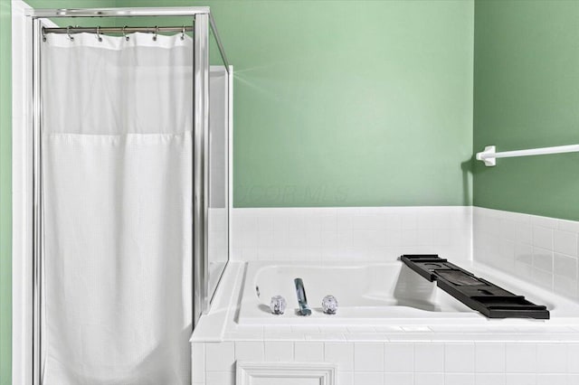 5821 Albany Grv, Westerville, OH 43081 - bathroom featuring a garden tub and curtained shower