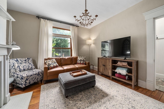336 E Kossuth St, Columbus, OH 43206 - living area with wood finished floors and a chandelier