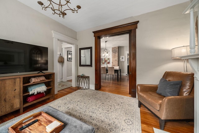 336 E Kossuth St, Columbus, OH 43206 - living area with wood finished floors and a chandelier