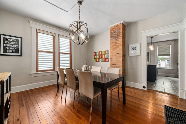 336 E Kossuth St, Columbus, OH 43206 - dining space featuring a chandelier and hardwood / wood-style floors