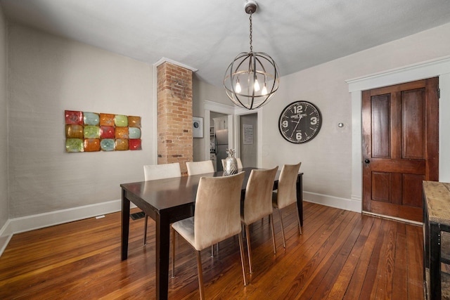 336 E Kossuth St, Columbus, OH 43206 - dining area featuring a chandelier and dark wood finished floors
