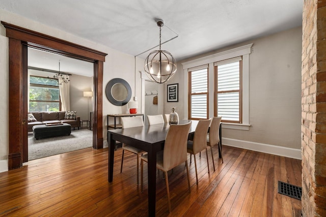 336 E Kossuth St, Columbus, OH 43206 - dining space with a chandelier and hardwood / wood-style floors