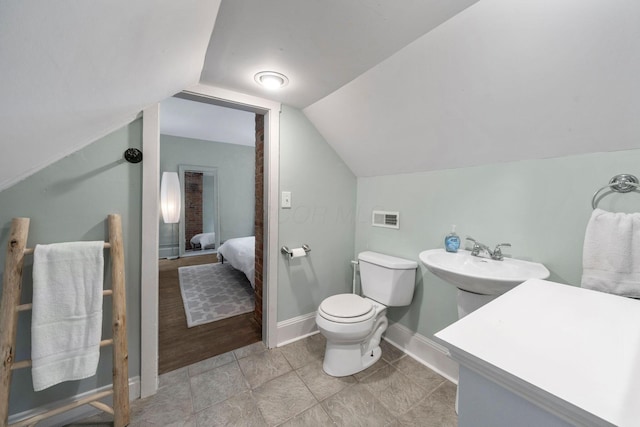 336 E Kossuth St, Columbus, OH 43206 - bathroom with toilet and vaulted ceiling